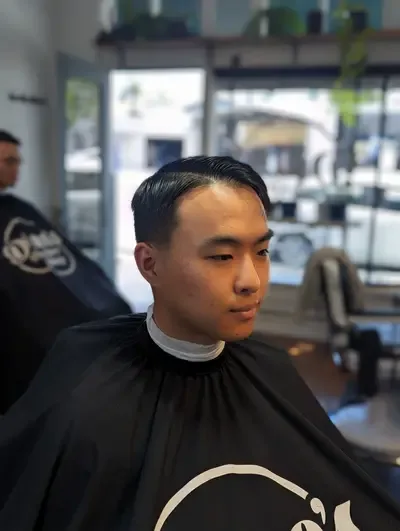 Expert barber cutting hair at Richmond VA location
